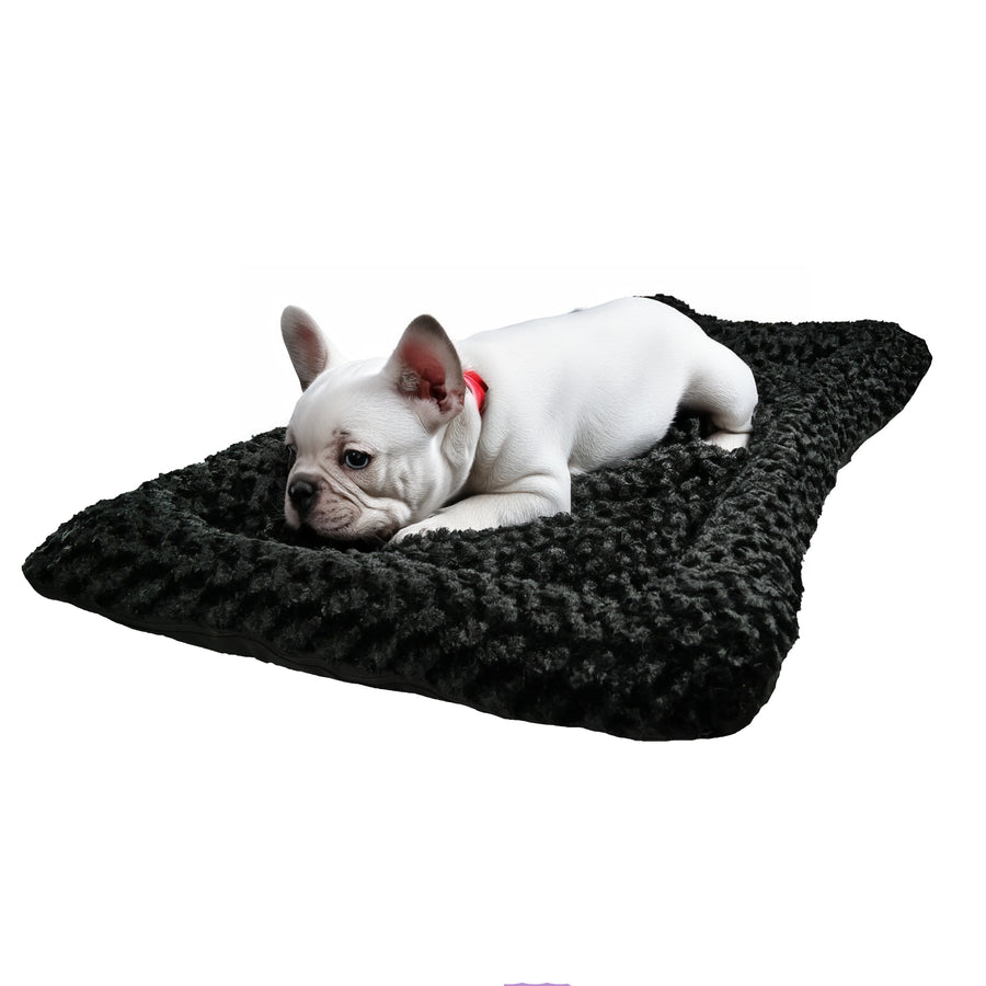 Black rectangle fleece dog bed with a white Frenchie laying on it.