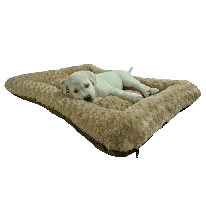 Camel colored rectangled fleece dog bed with a white Labrador puppy lying on it.