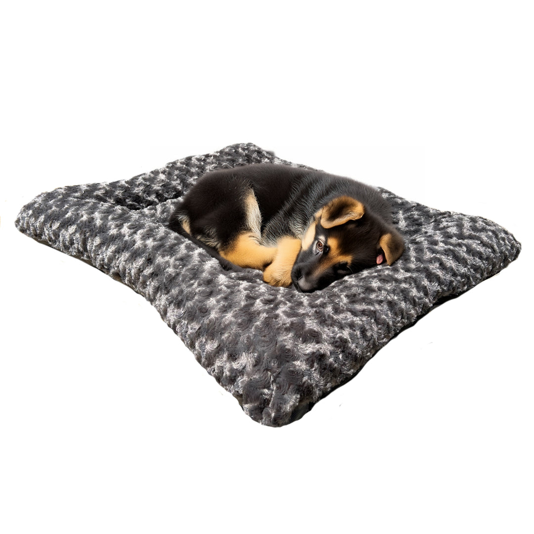 Rectangle charcoal colored fleece dog bed with a German Shepard puppy lying on it.