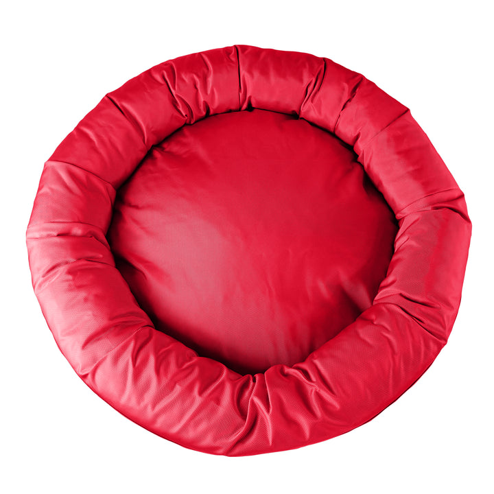Top view of a red round bolstered dog bed.
