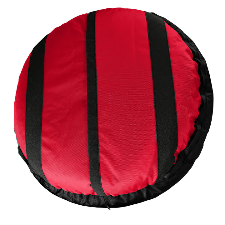 Bottom of a red round bolstered dog bed with black strips and black band.