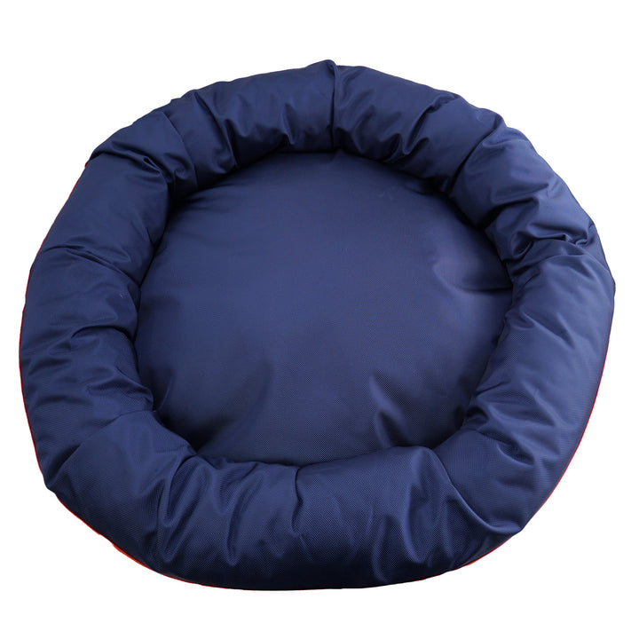 Top view of  navy round bolstered dog bed.