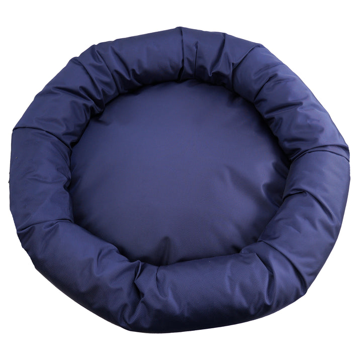 Top view of a navy round bolstered dog bed.