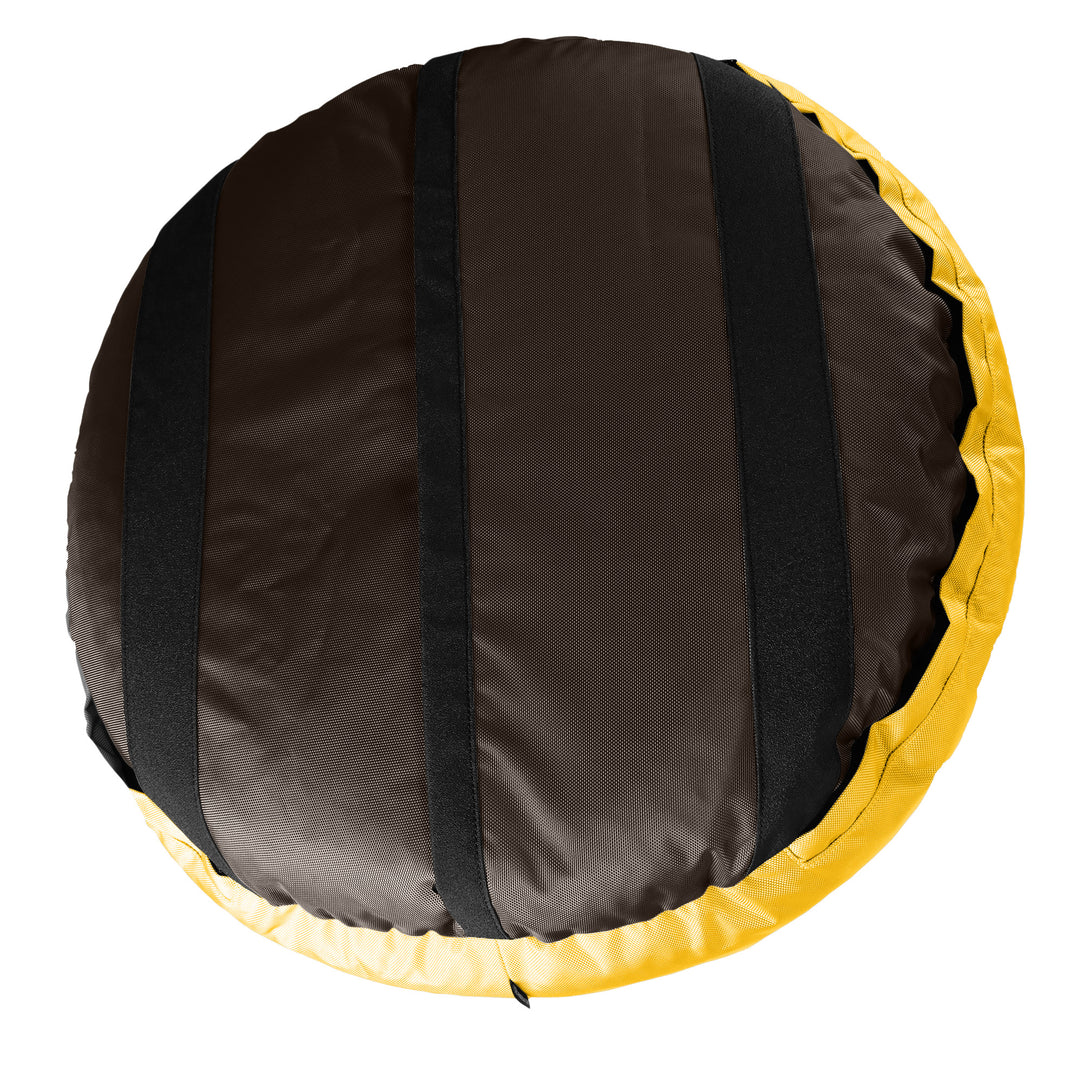 Bottom of a brown round bolstered dog bed with black strips and yellow band.