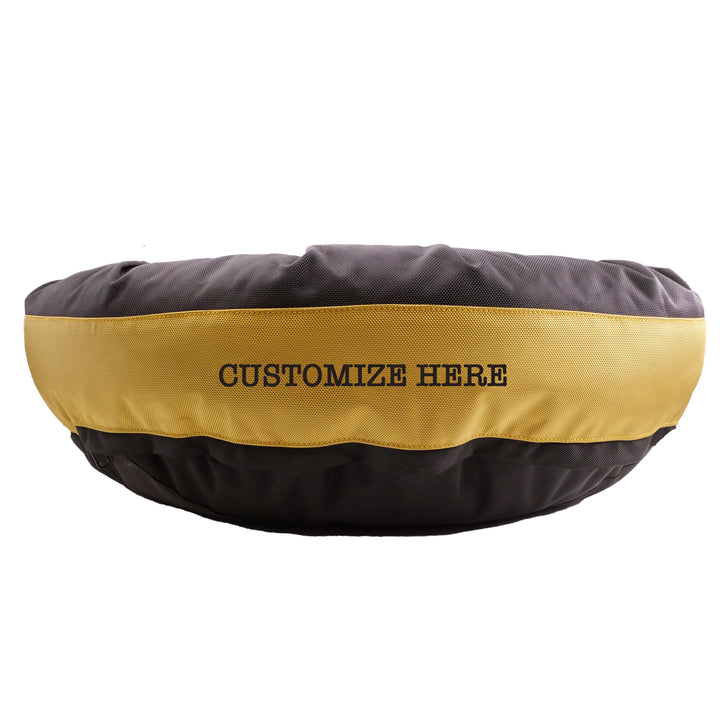 Round bolstered Black and Gold Dog bed with Customize Here embroidered in black