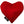 Red heart-shaped dog toy with 'American Dog' tag on a white background