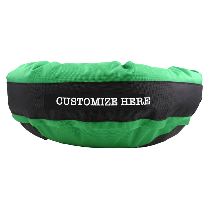 Green round bolstered dog bed with a black band and white embroidered 'Customize Here'.