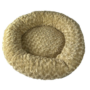 Round fuzzy camel colored round bolster dog bed top view 