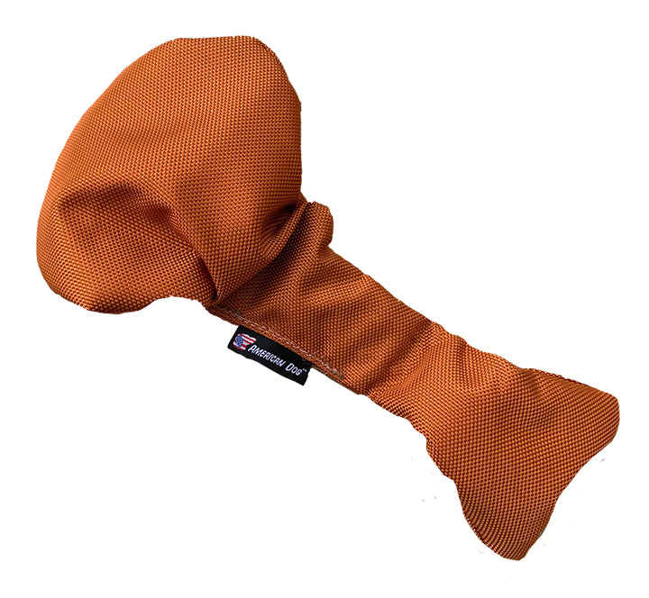 Golden brown turkey leg shaped dog toy that stretches