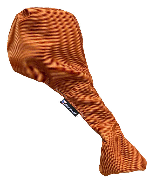 Golden brown turkey leg shaped dog toy that stretches