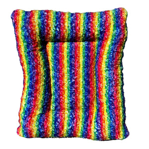 Top view ofRainbow striped fleece dog bed.  rectangle shape with side bolsters