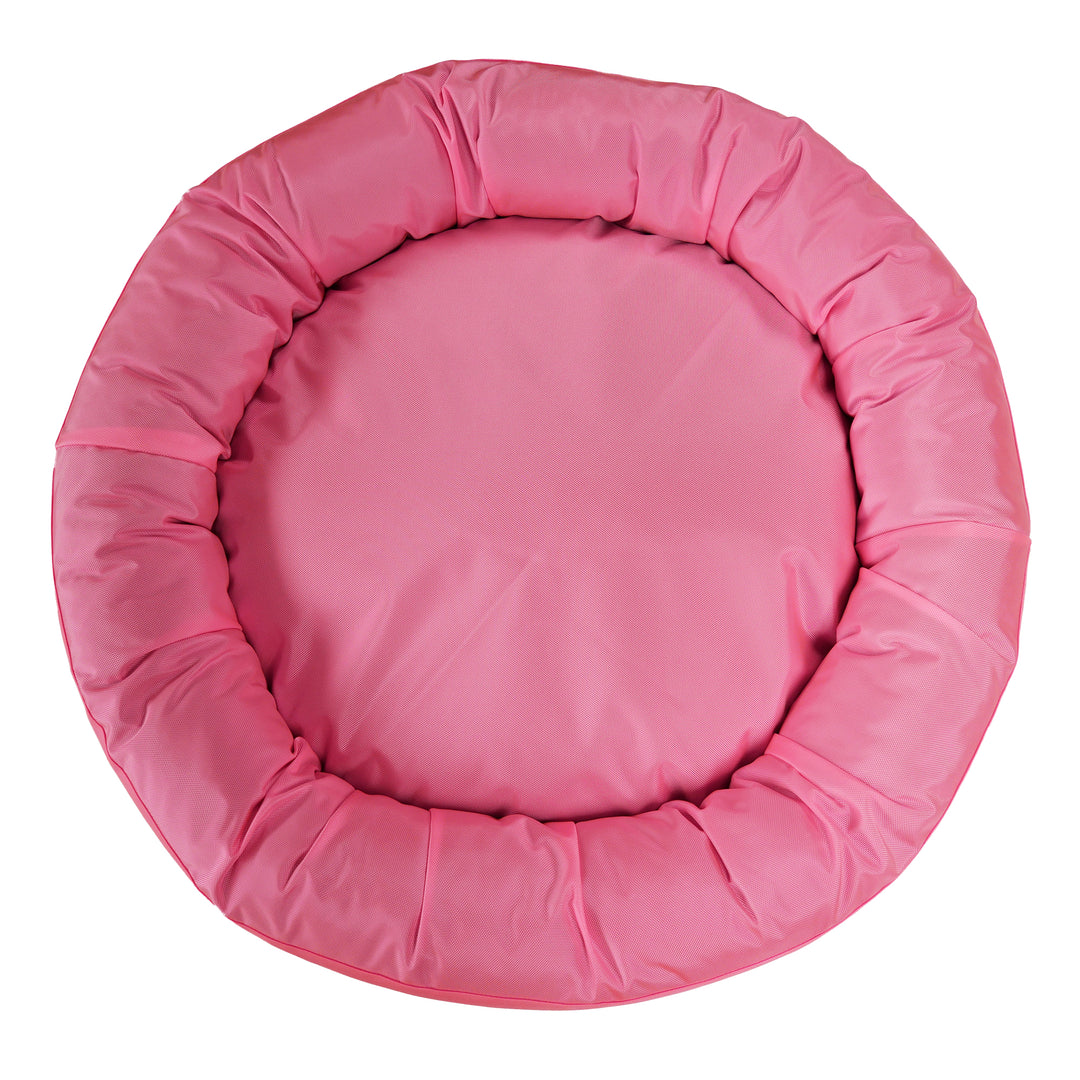Top view of pink round bolstered dog bed.