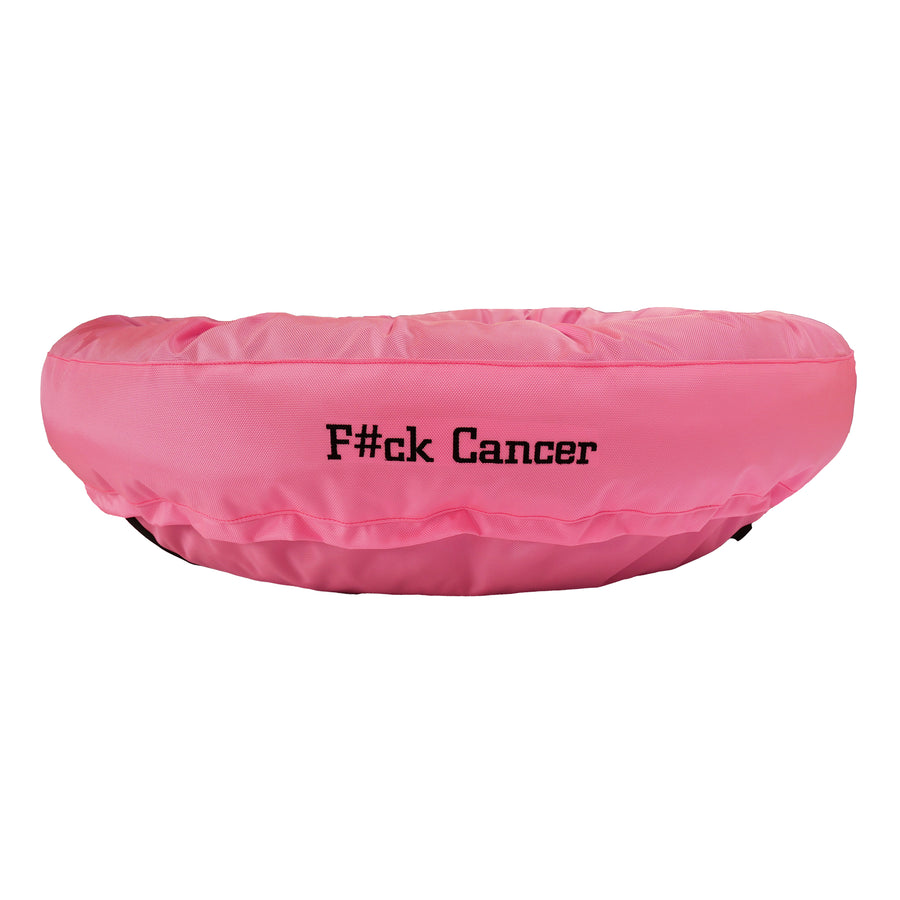 Pink round bolstered dog bed with black embroidered 'F#ck Cancer'.