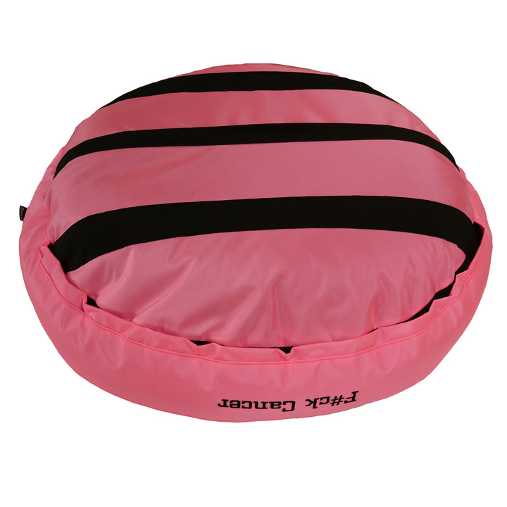 Bottom of pink round bolstered dog bed with black strips.
