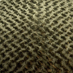 Olive colored swirly fleece close up