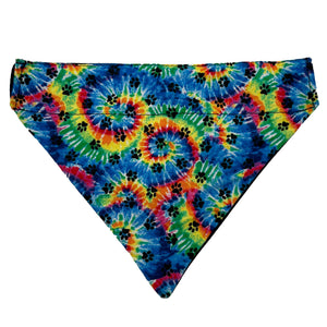 Slip on bandana with rainbow swirls and black dog paw prints.