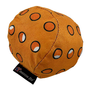 Orange pickle ball dog toy
