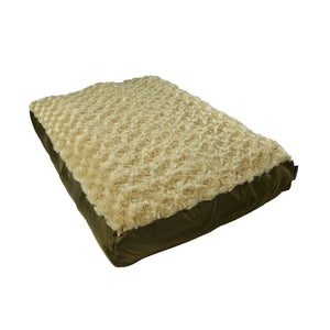 A rectangular beige dog bed with a soft minky fleece top and a nylon ballistic bottom.