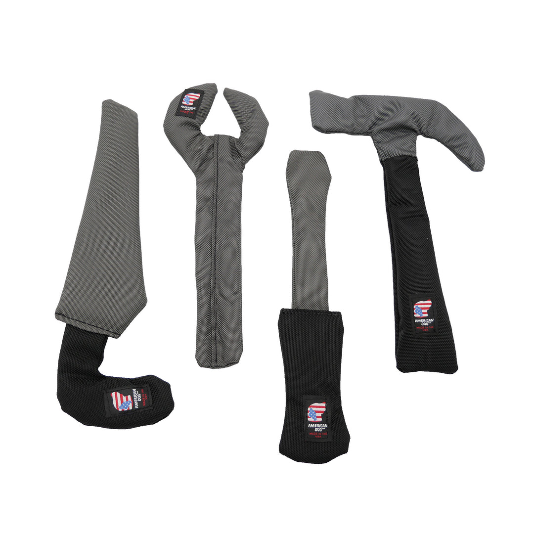 Gray and black saw, wrench, screwdriver, and hammer toy (group shot)
