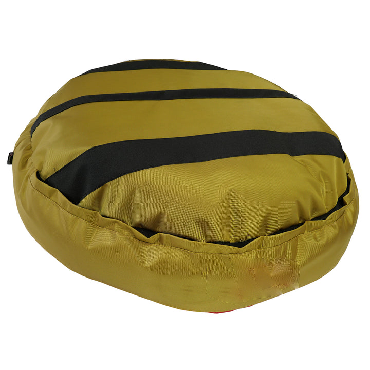 Gold bottom of  a round bolstered dog bed with black strips.