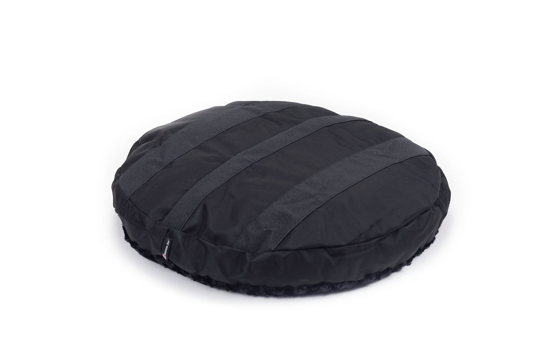 Round bed fuzzy black back side showing grip strips