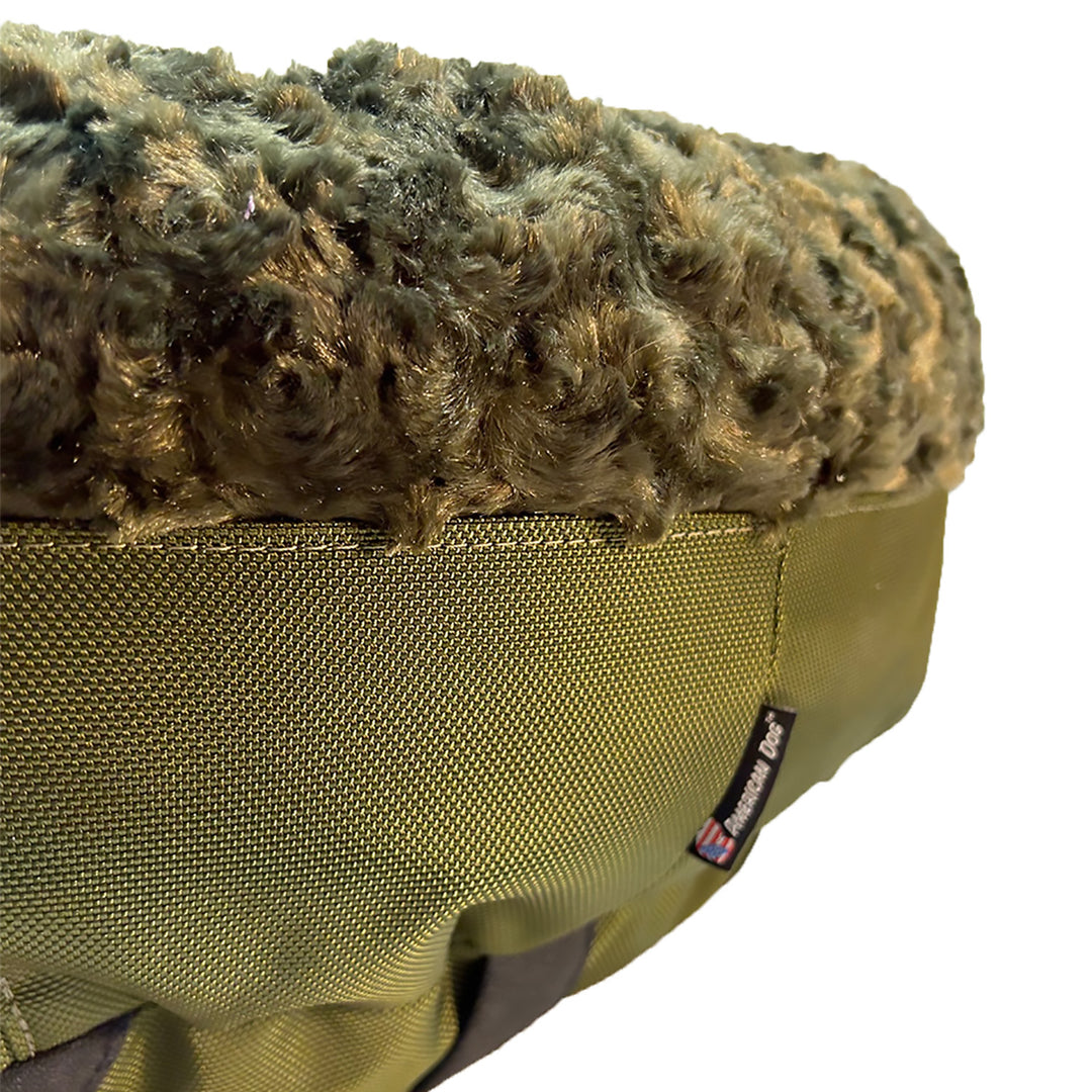 close up of olive colored fleece and texture lover  of a dog bed