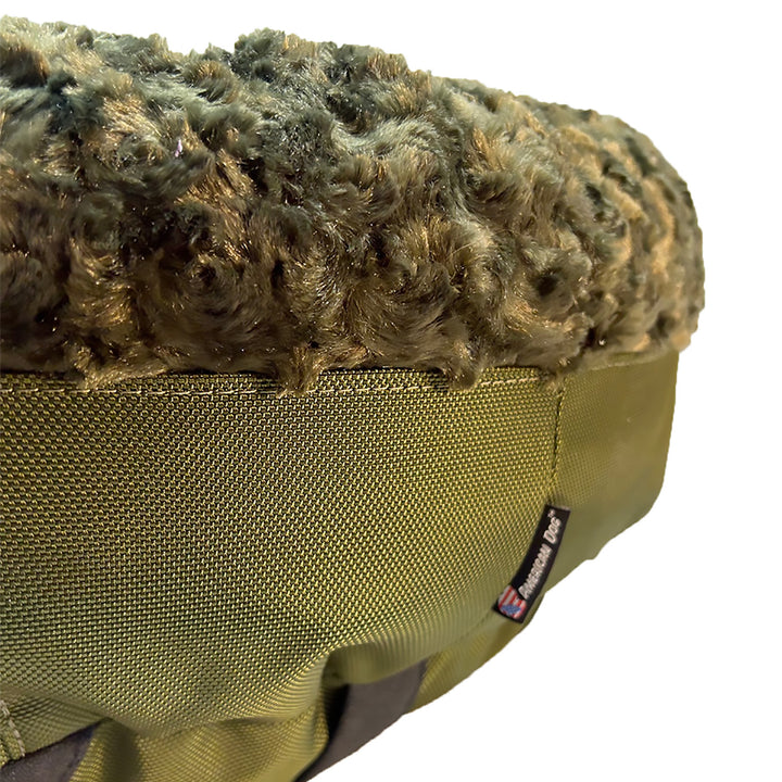 close up of olive colored fleece and texture lover  of a dog bed
