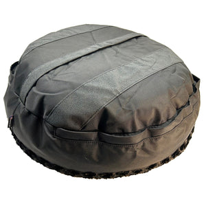 bottom of black bolstered dog bed with black strips