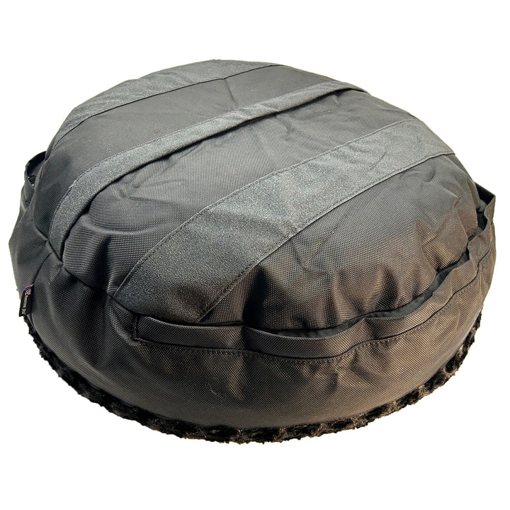 bottom of black bolstered dog bed with black strips