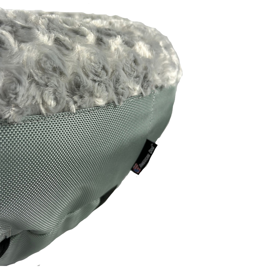 close up of silver fleece round bolstered dog bed