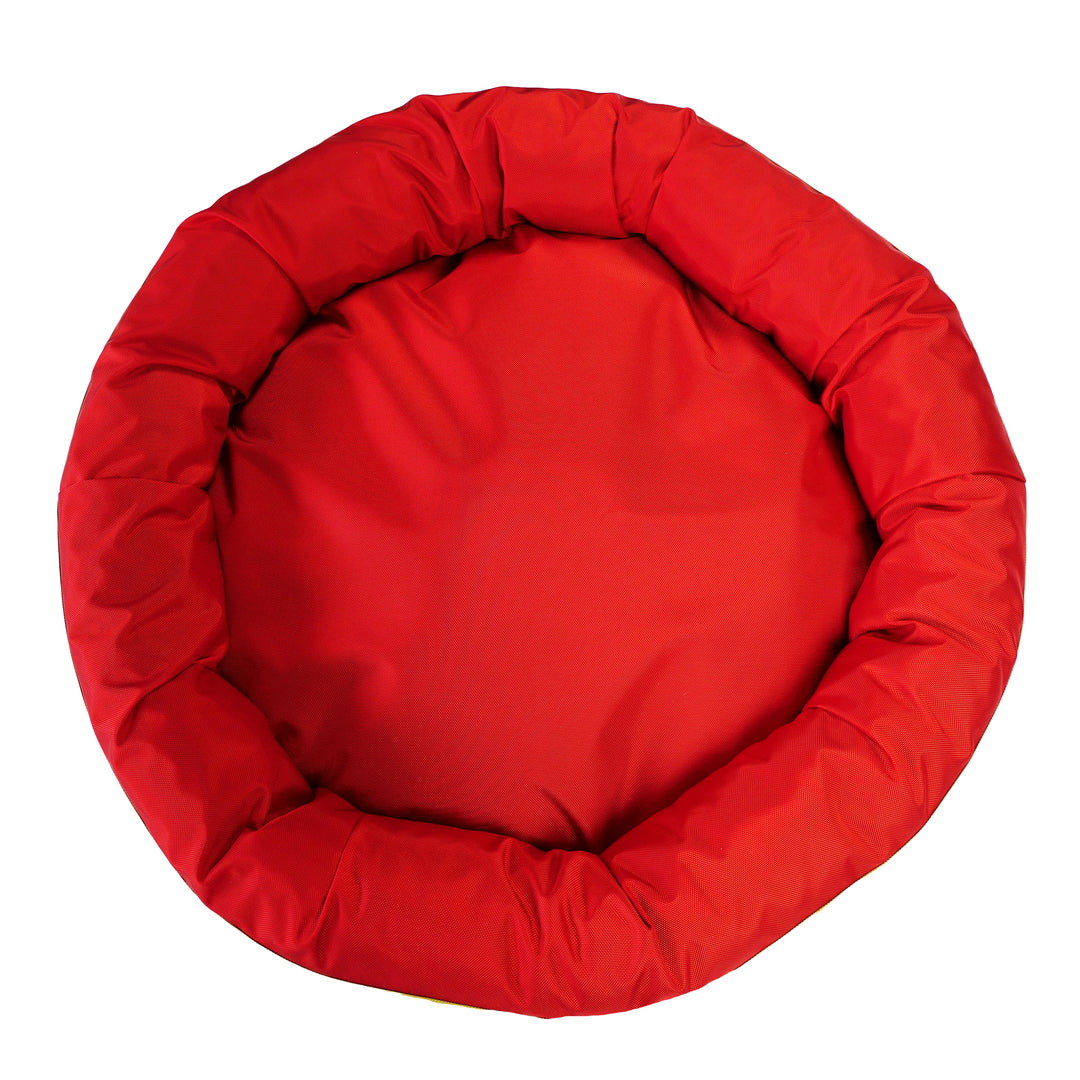 Top view of red round bolstered dog bed.