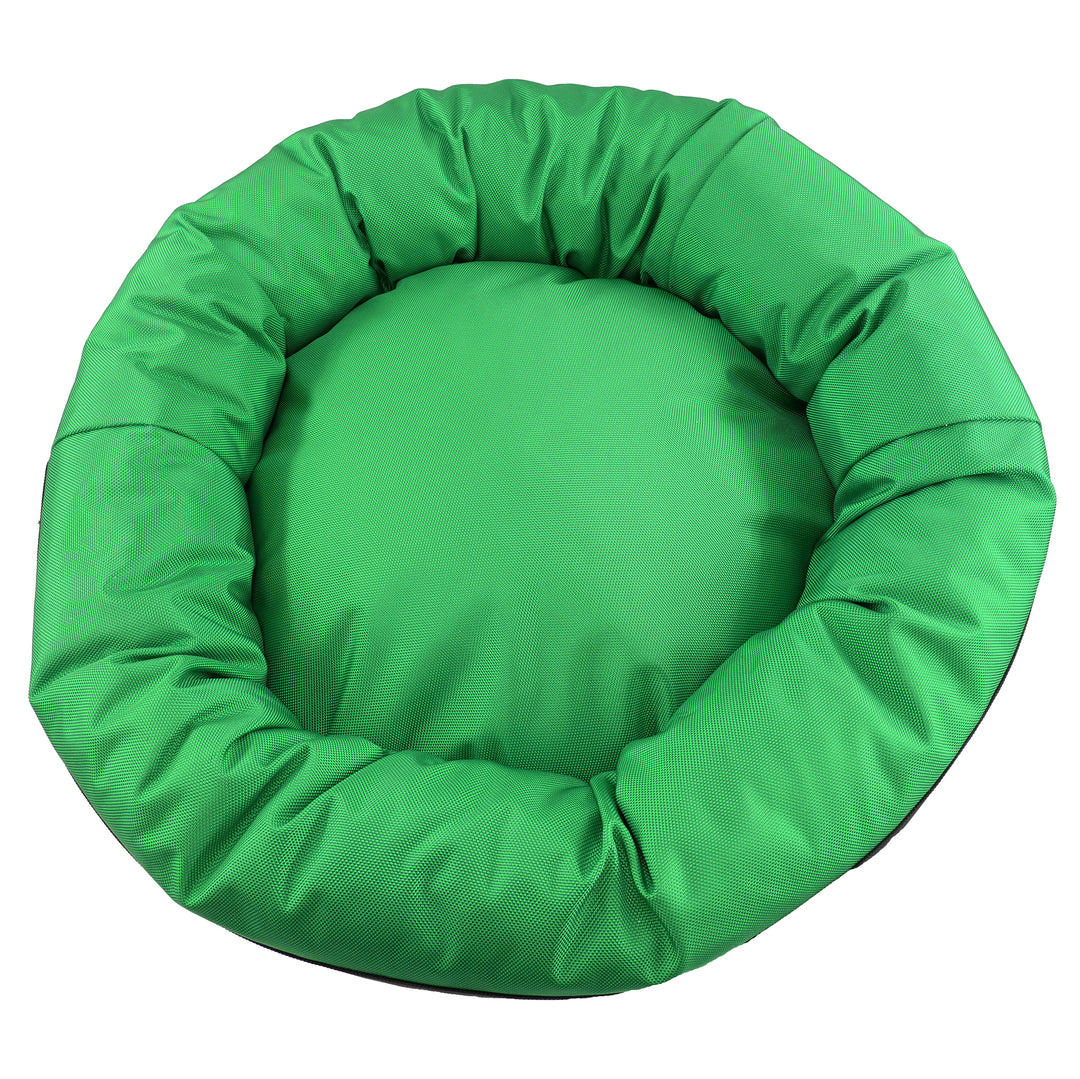 Top view of green round bolstered dog bed.