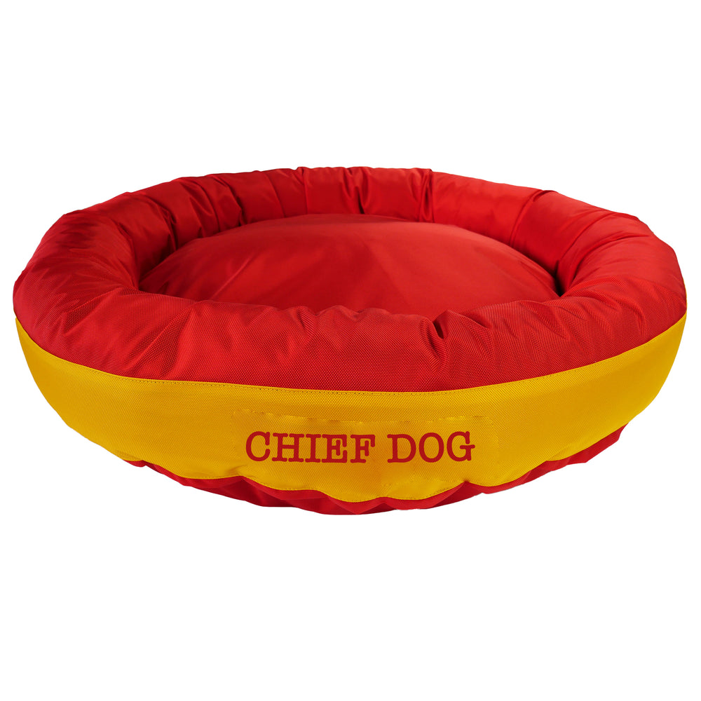 Red round bolstered dog bed with a yellow band and red embroidered 'Chief Dog'.
