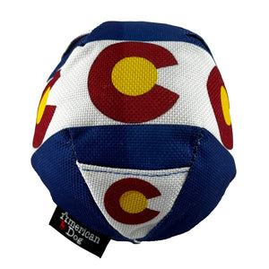 round  blue with a ball with a white band.  Red c's  with a yellow center and little treat pockets