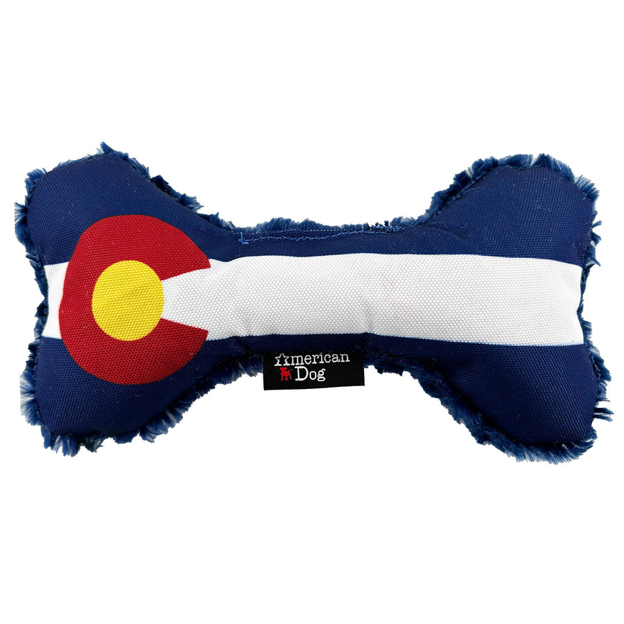Bone shaped dog toy with coloring of the Colorado Flag  Red C with a yellow center and blue and white stripes
