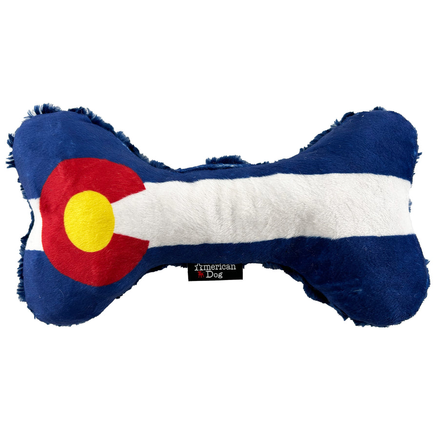 Bone shaped dog toy with coloring of the Colorado Flag  Red C with a yellow center and blue and white stripes