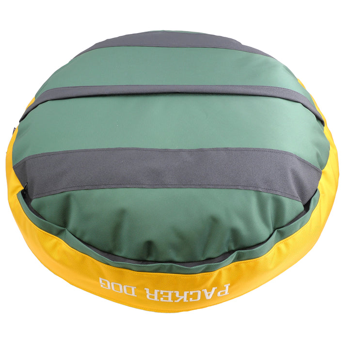 bottom of bed with black stripes on green base with gold sides