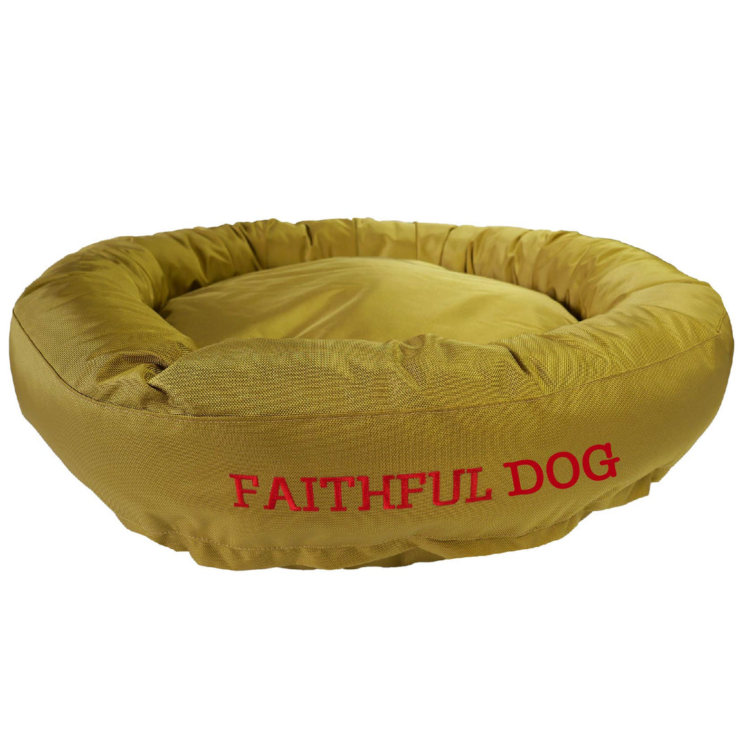 Gold round bolstered dog bed with red embroidered 'Faithful Dog'.