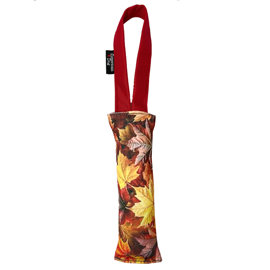 Fire hose dog toy with autumn leaf pattern and red handle 