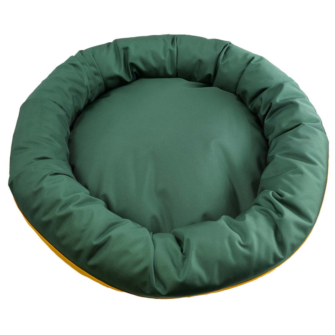 Top view of round bolstered dog bed.  Dark green.