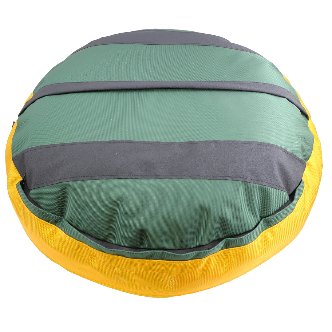 Bottom of round dog bed.  Green with black stripes and gold border.