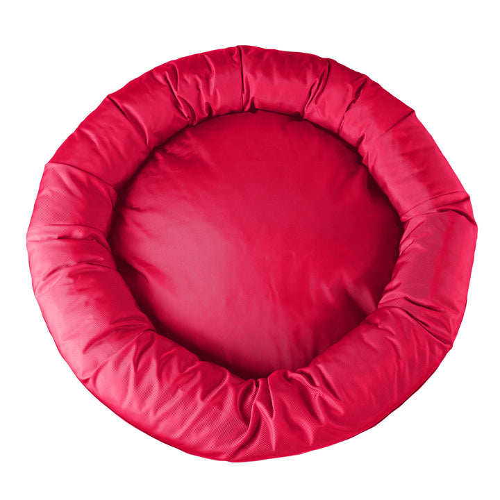 Top view of round bolstered red dog bed 