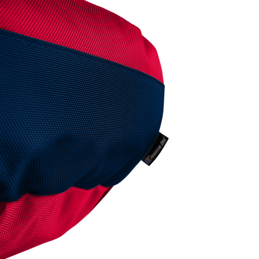Close up view of fabric red with navy in middle