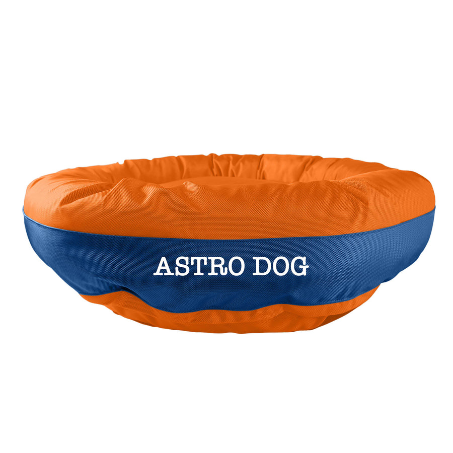 Orange  bolstered dog bed with blue band in center with 'Astro Dog' white embroidery.