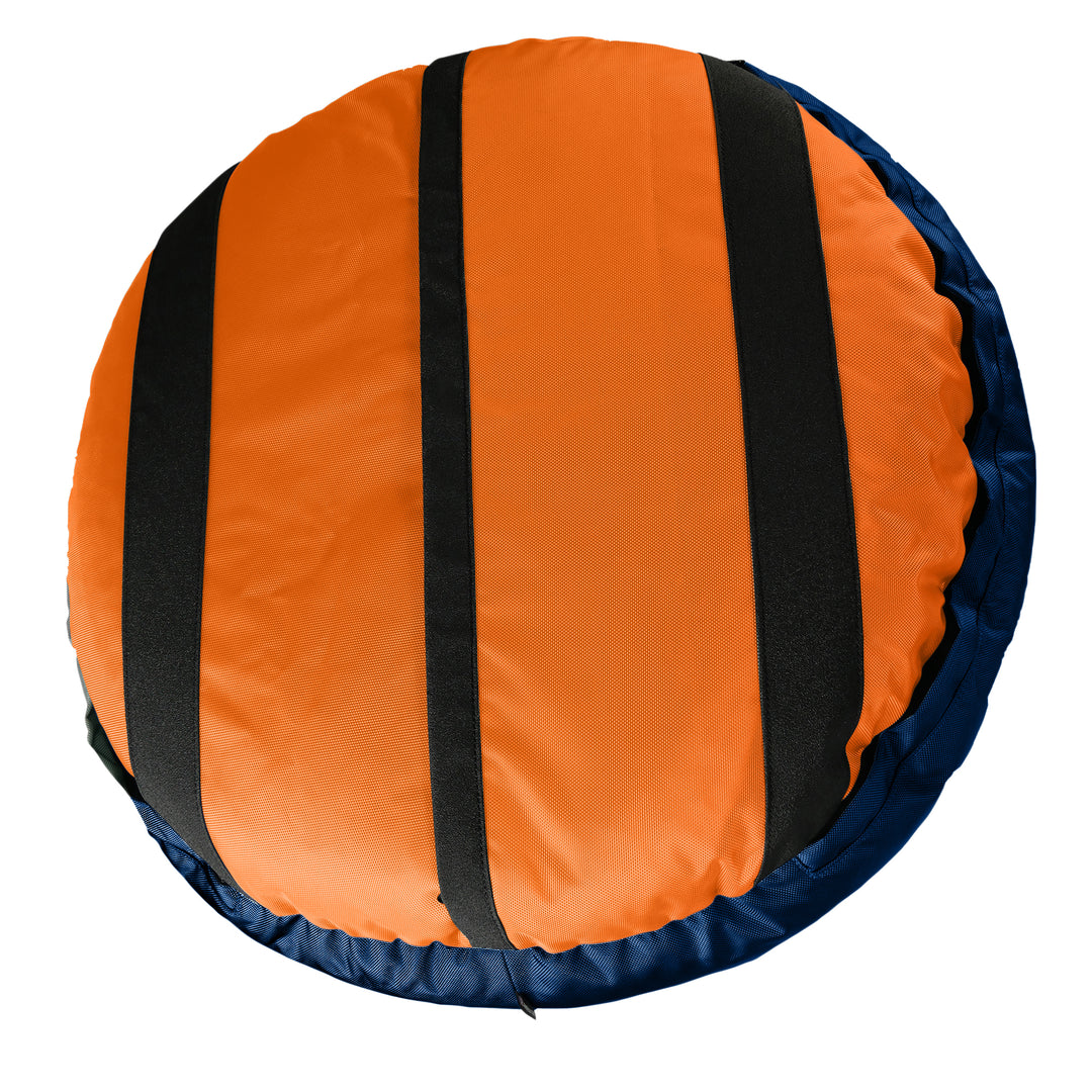 Bottom view of round dog bed.  Orange with black strips.