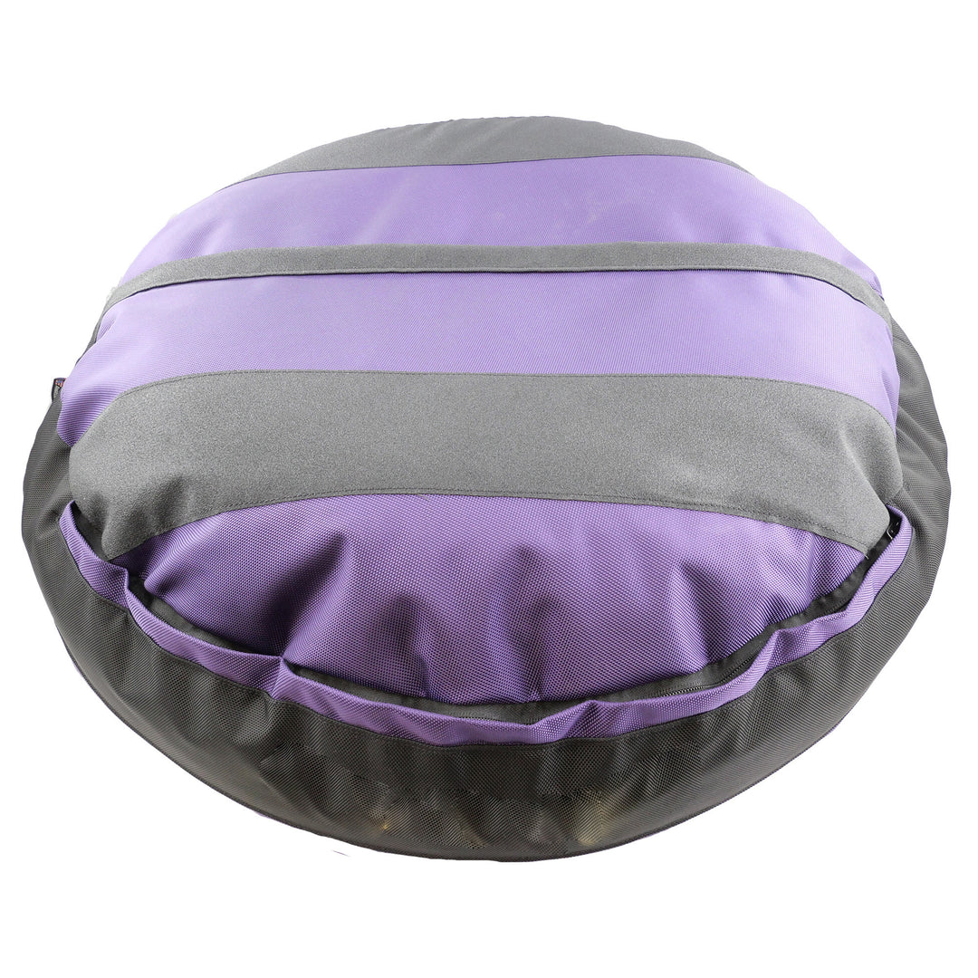 Bottom of purple round bolstered dog bed with black strips and black band.