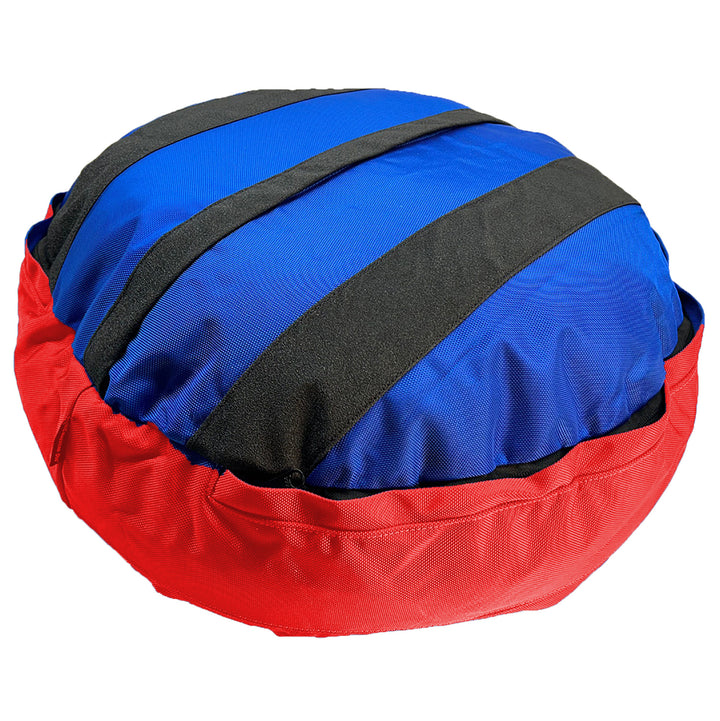 Bottom of blue bolstered dog bed with red band   Black strips on blue bottom
