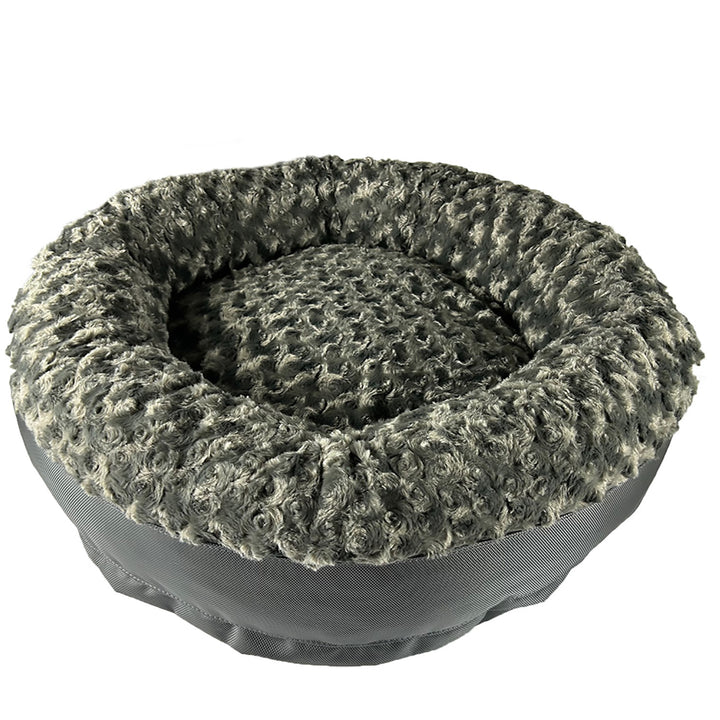 a charcoal colored round bolstered fleece dog bed