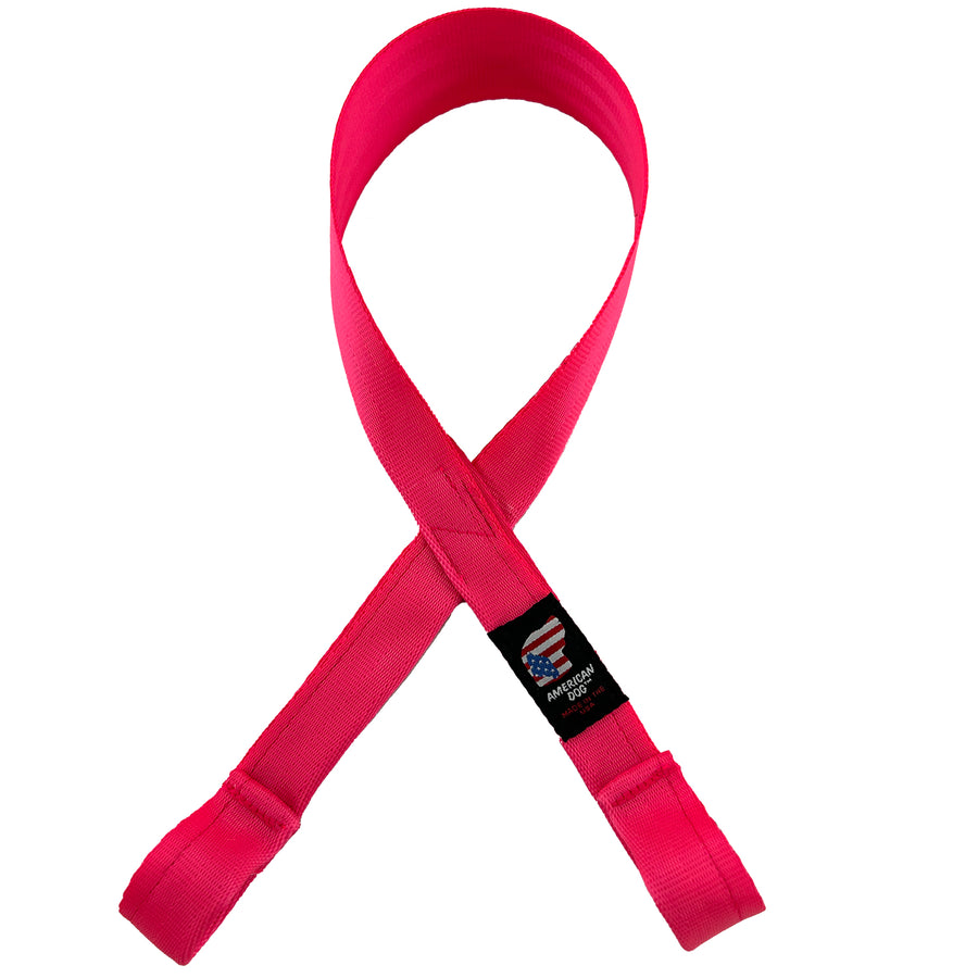 Pink seat belt crossed in the middle to create cancer awareness tuggable toy