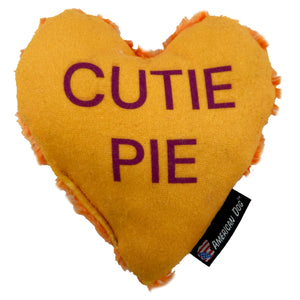 Orange heart shaped dog toy with 'Cutie Pie' on it